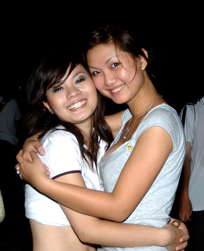 Two cute Vietnamese girls hugging